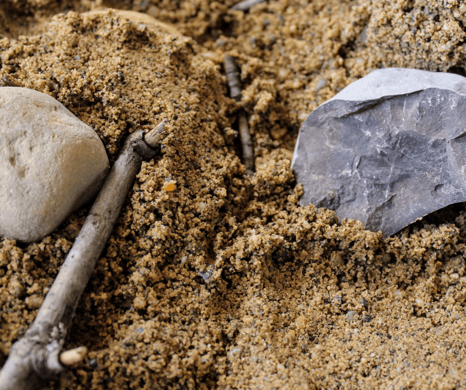 adding twigs to the sand 