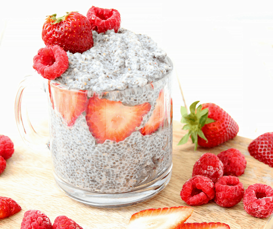 cup of coconut milk chia pudding with raspberries and strawberries