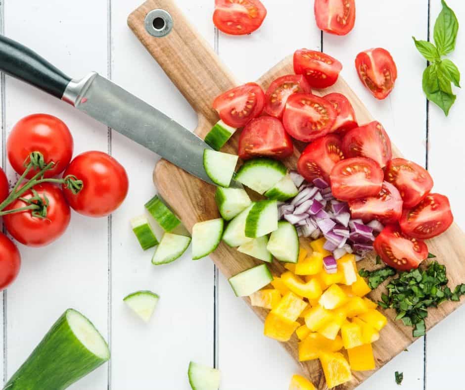 simple side salad prep - fresh summer vegetables on cutting board