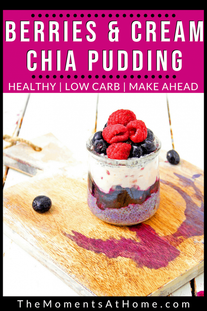 berries on top of chia seed pudding in a glass jar on stained wooden board