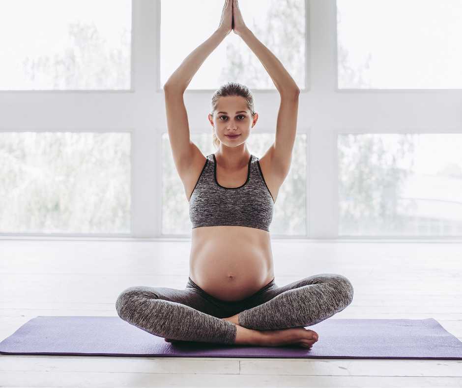 pregnant woman doing yoga for her pregnancy fitness routine