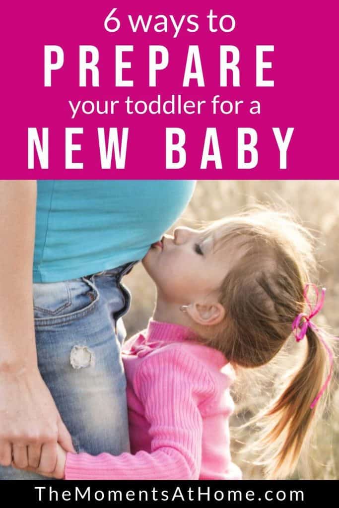 6 ways to prepare your toddler for a new baby in the family; toddler kissing baby from The Moments At Home