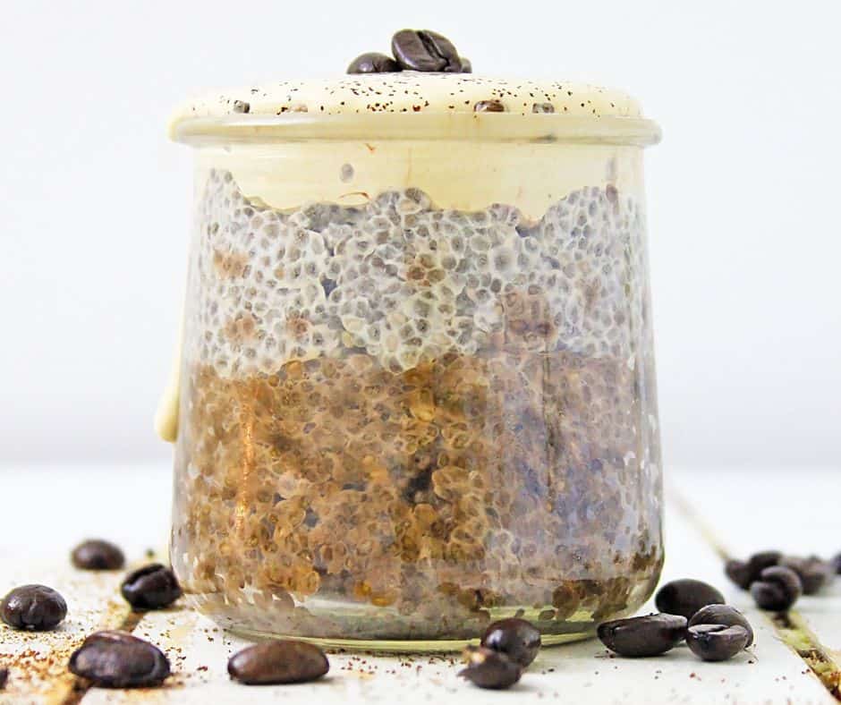 Coffee Chia Pudding on a white base with coffee beans