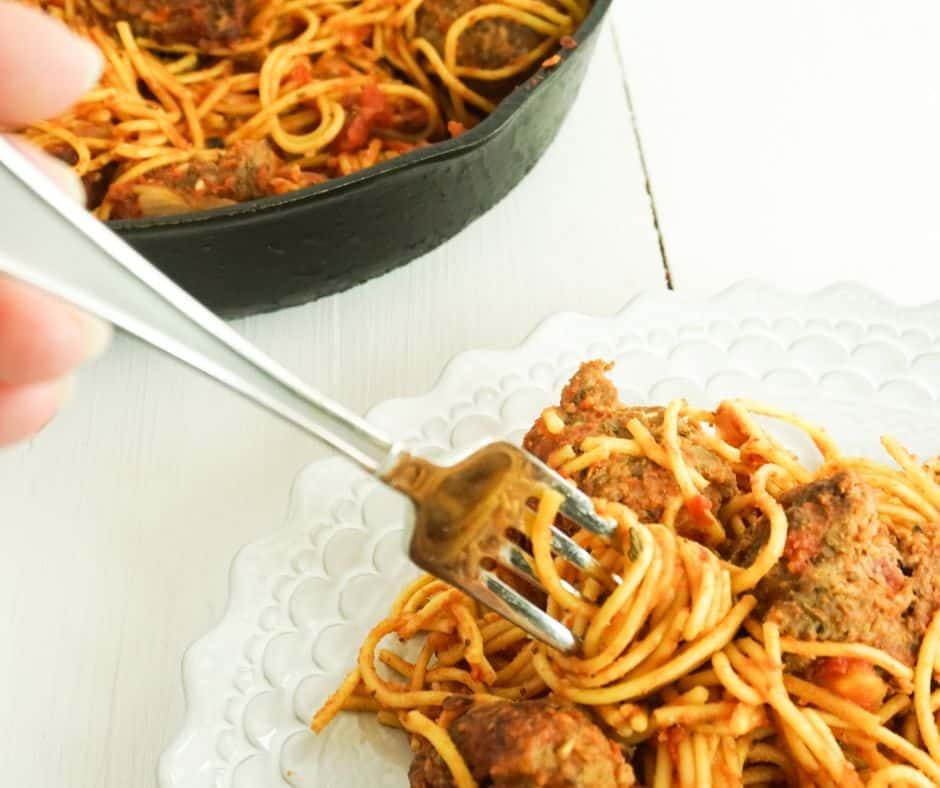 plated meal of one dish spaghetti and meatballs cooked in a cast iron skillet