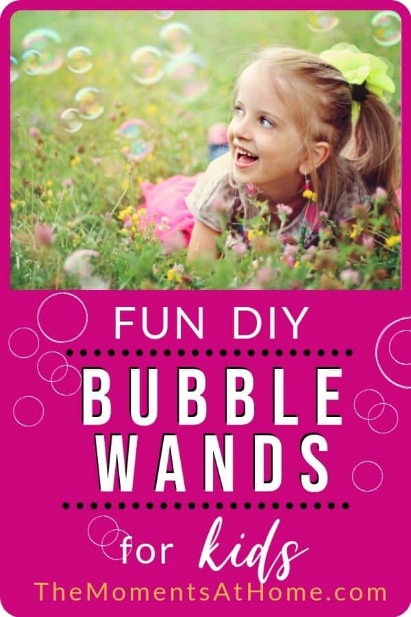 girl in field of flowers looking at bubbles with text "DIY Bubble Wands for kids" by The Moments At Home