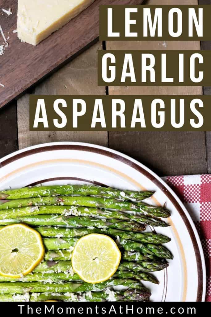 plate of roasted asparagus with text "lemon garlic asparagus" by The Moments At Home
