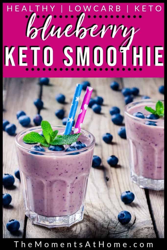 blueberries on wood with two blueberry cheesecake keto smoothies in glasses with text "blueberry keto smoothie" by The Moments At Home