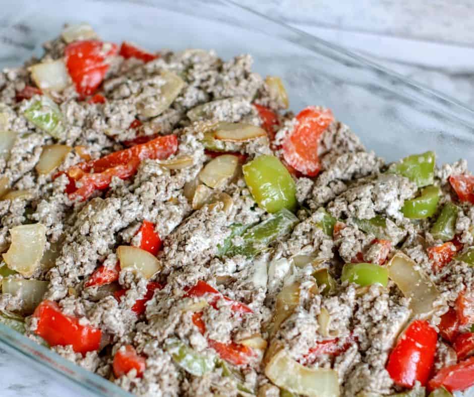 Beginning layers of cheesesteak casserole