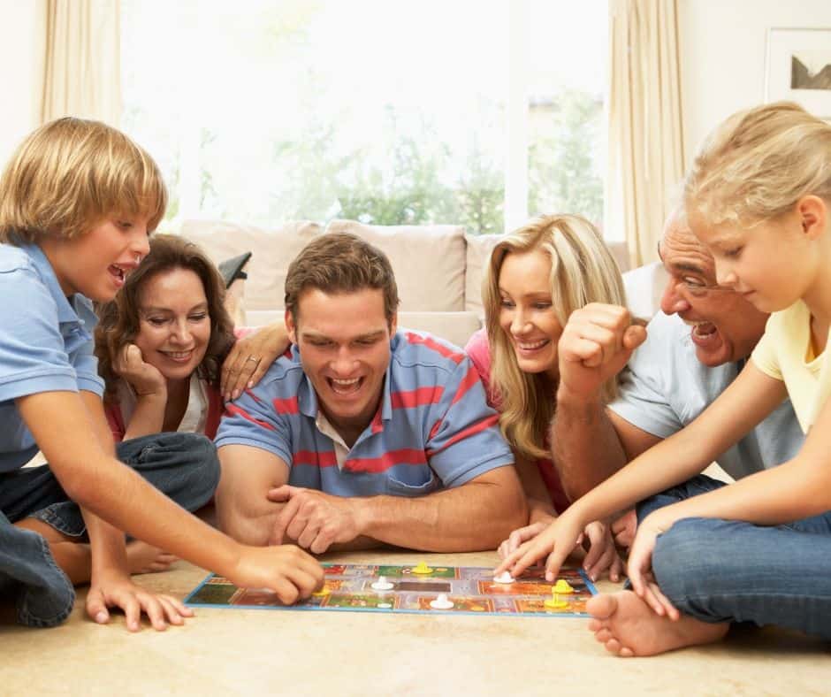 family playing board game together and having fun