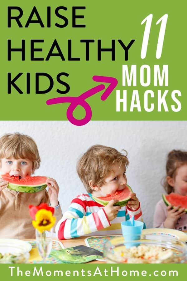 kids eating fruit with text "raise healthy kids with these 11 mom hacks" by The Moments at Home