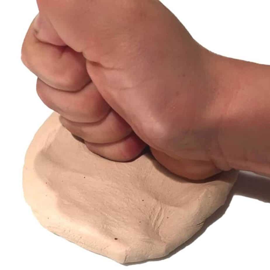 hand pounding salt dough for ornament