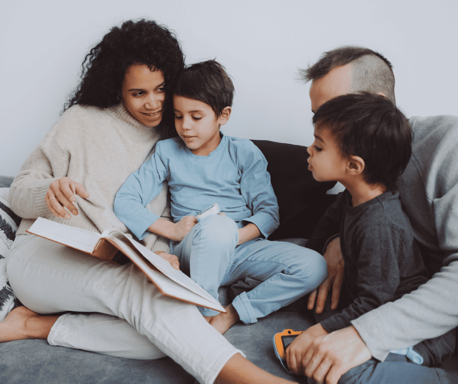 family reading a book together