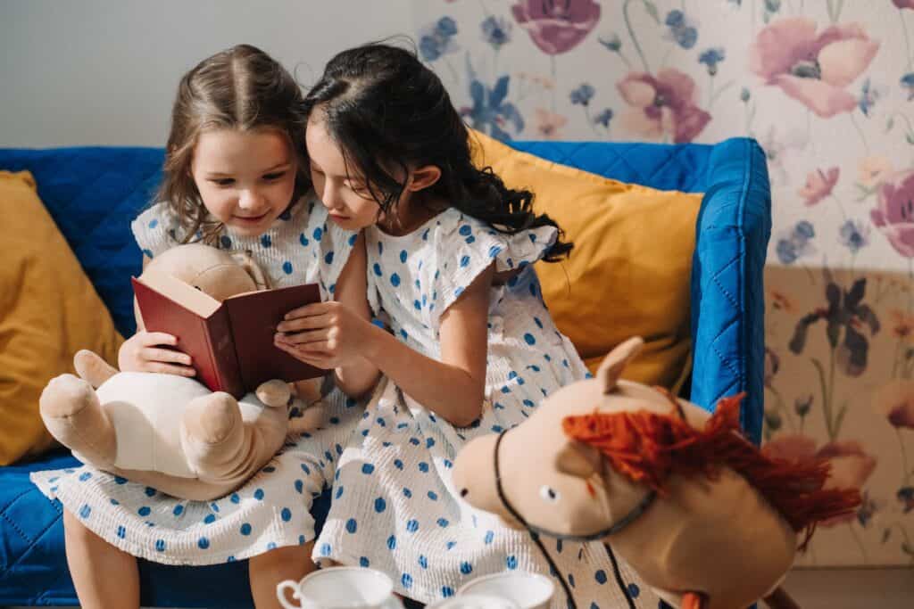 two girls reading together